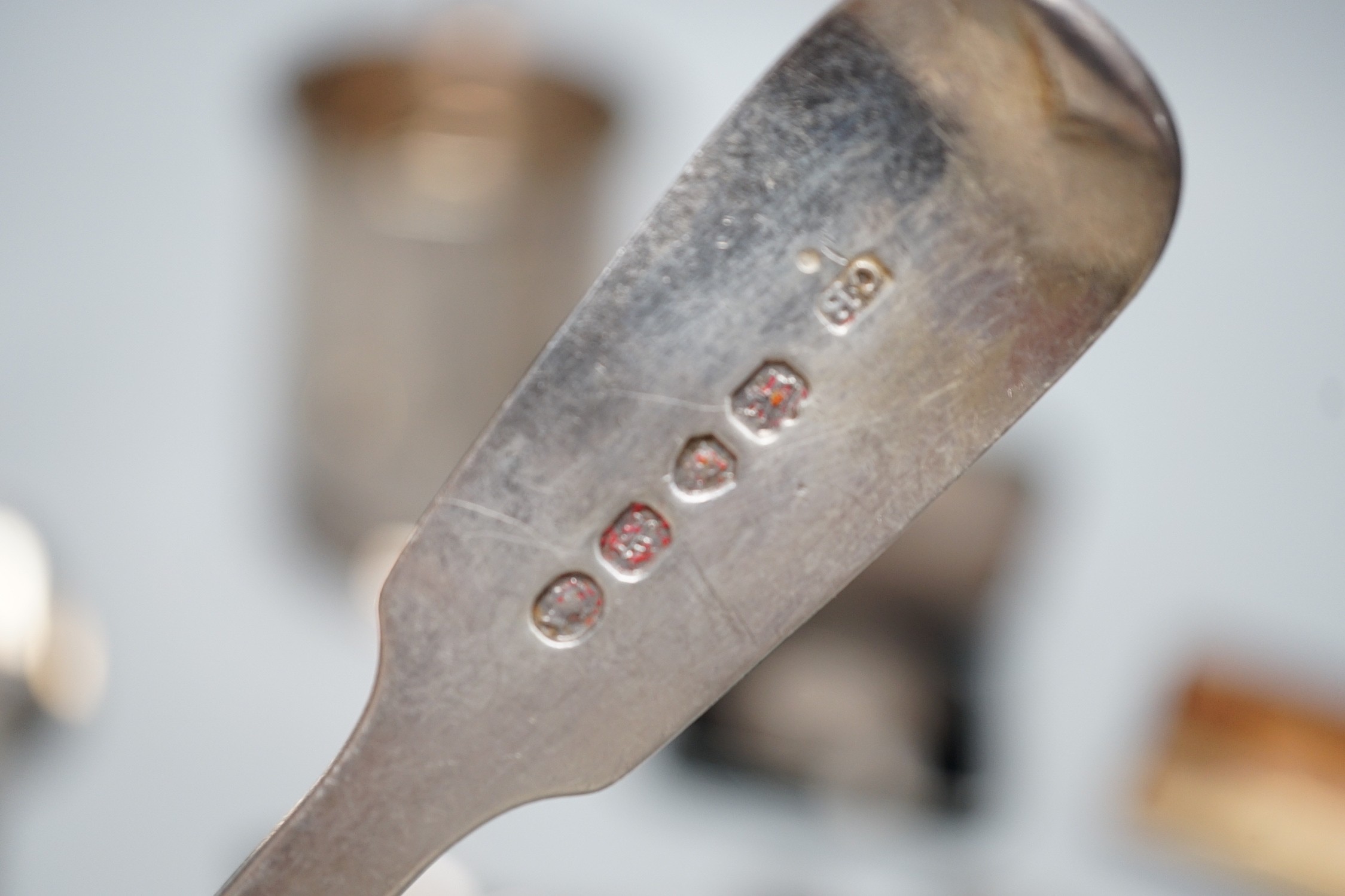 A George VI silver mug, with engraved inscription, James Dixon and Sons, Sheffield, 1943, 11.3cm, together with twelve items of silver flatware including set of six William IV silver fiddle pattern teaspoons, a silver al
